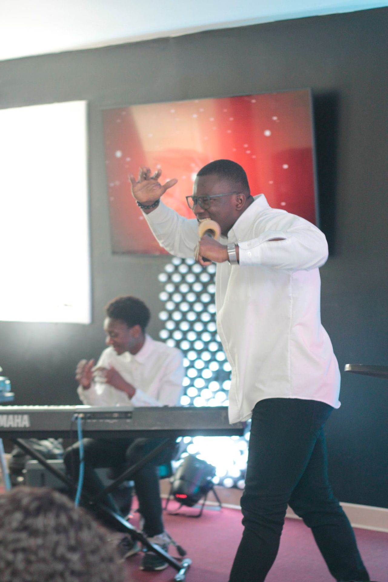 Gabriel speaking during a worship gathering